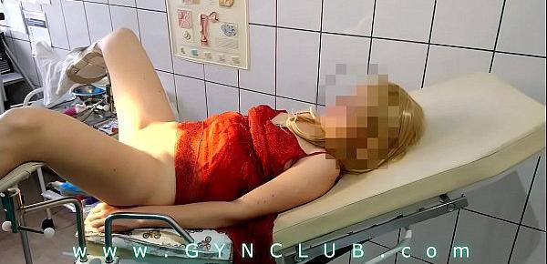  Woman in red dress on gyno exam